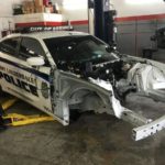A police car that is in the garage.